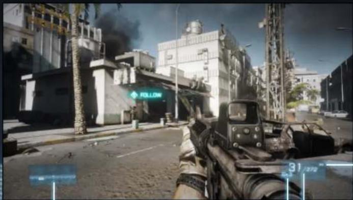 Street scene from a video game showing a rifle in foreground with industrial buildings and smoke (no readable text or symbols)