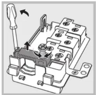 Mechanical assembly diagram showing a clamping device with arrows indicating motion (no text or symbols present)