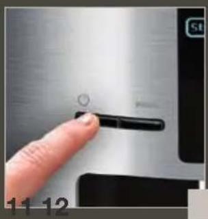 Close-up of a finger pressing a button on a metallic surface, no visible text or symbols.