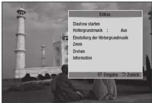 Extras Diashow starten Hintergrundmusik : Aus Einstellung der Hintergrundmusik Zoom Drehen Information Eingabe Zurück