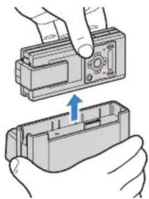 Illustration of two hands installing a mechanical component, one pointing at the interior and the other showing a blue arrow indicating motion (no text or symbols present)