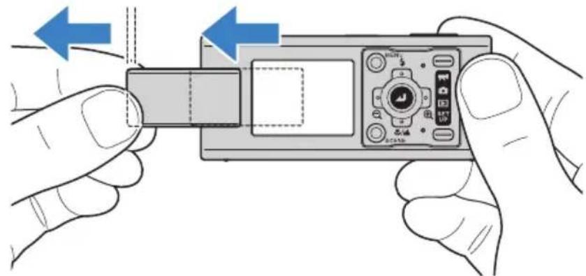 Illustration of hands holding a digital camera module with blue arrows indicating left-hand movement (no text or symbols)