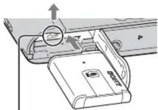 Diagram of a device's internal structure showing a device with a magnified inset and directional arrows (no text or symbols)