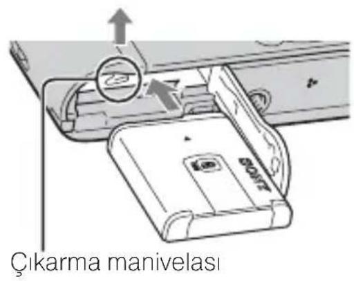 Diagram showing a device being inserted into a digital controller, with no visible text or symbols.