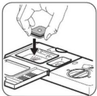 Diagram showing a hand holding a small electronic component with a 20-pin slot, indicating a pin or socket design.