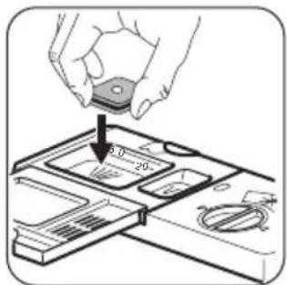 Diagram showing a hand holding a small electronic component with a 20-pin slot, indicating a disassembly or disassembly process.