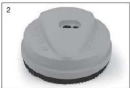 Close-up of a white plastic mechanical component with a circular opening and textured surface (no text or symbols visible)
