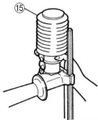 Technical diagram of a mechanical device with numbered component (15) and labeled parts