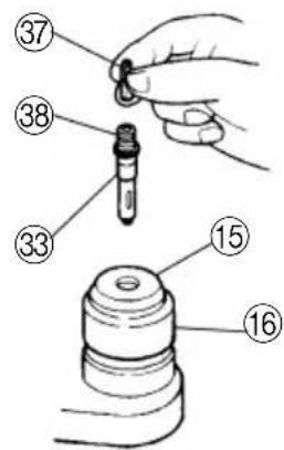 Diagram showing a hand holding a dropper and a mechanical component with numbered parts labeled 15, 16, 33, 37, and 38.