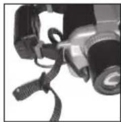 Close-up of a camera with attached cable and lens (no visible text or symbols)