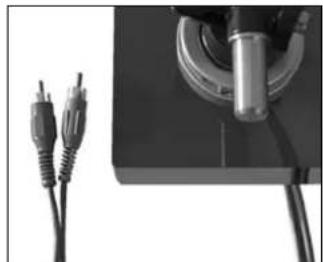 Close-up of a mechanical component with two USB cables attached to a base (no visible text or symbols)