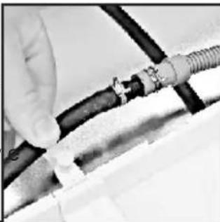 Close-up of hands connecting a black cable with a coiled wire. No visible text or symbols.