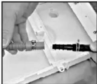 Close-up of hands using a tool to adjust or install a mechanical component (no visible text or symbols).