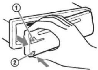 Diagram showing hand positioning of a device with numbered parts and directional arrows indicating movement or force.