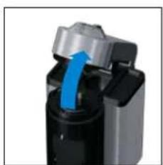 Close-up of a mechanical device with a blue arrow indicating direction (no visible text or symbols)