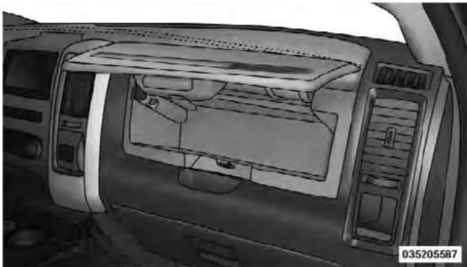 Interior view of a car showing the dashboard, air intake manifold, and control panel (no text or symbols visible)