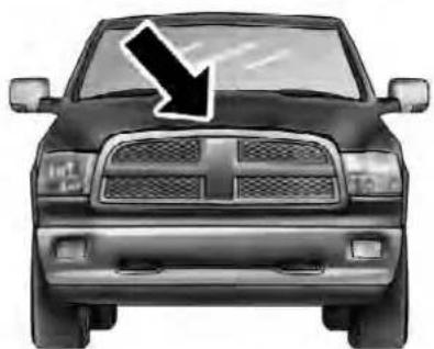 Front view of a black and white pickup truck with a downward arrow on the windshield (no text or symbols)