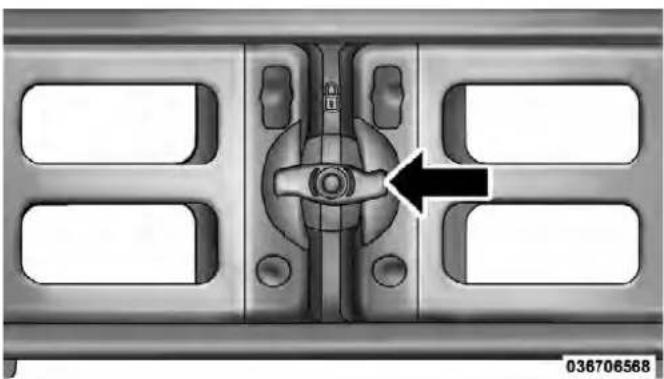 Mechanical component with central knob and mounting holes, no visible text or symbols