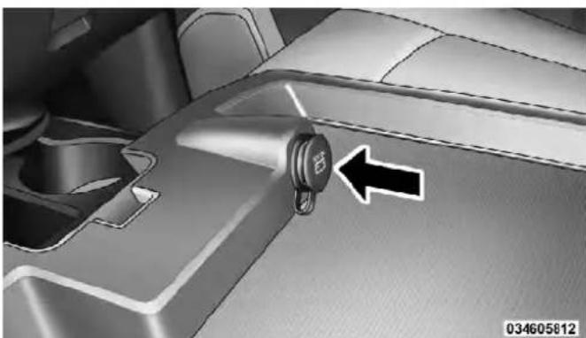 Close-up of a car interior showing a keyhole and directional arrow (no text or symbols)