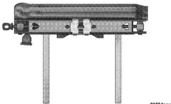 Technical line drawing of a mechanical device with two vertical posts and mounting feet (no text or symbols)