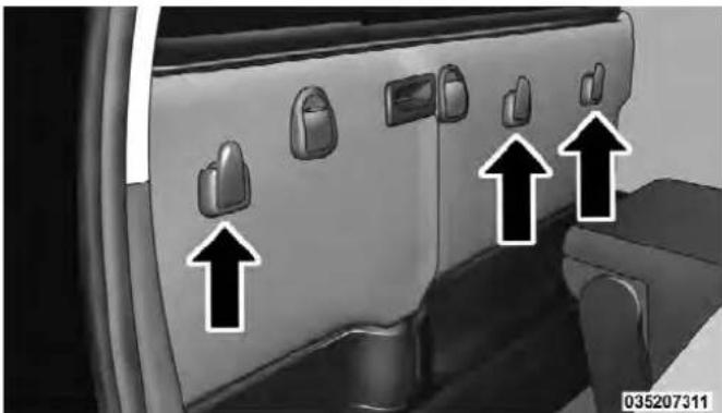 Interior view of a car showing three directional arrows pointing to the side panels (no text or symbols present)