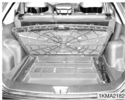 KIA Sportage (2010) - SOUTE À BAGAGES CENTRALE (SELON L'ÉQUIPEMENT) - 1