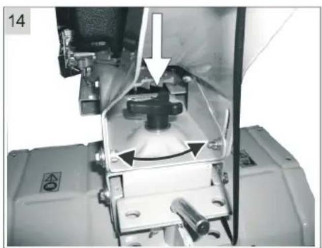 Close-up of a mechanical device with internal components and a white arrow indicating a motion or operation (no visible text or symbols)