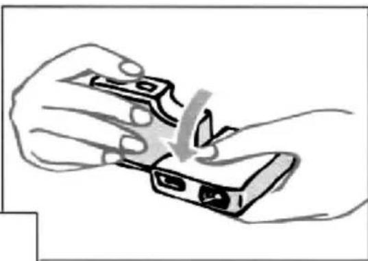 Illustration of hands holding a device with a downward arrow indicating compression or disassembly (no text or symbols)