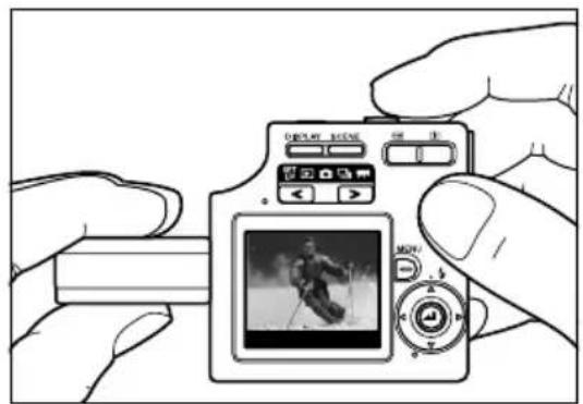 Illustration of a hand holding a digital camera with a screen showing a skier (no text or symbols visible)