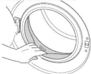 Illustration of a hand cleaning a circular mechanical component (no text or symbols)