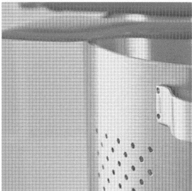 Close-up of a textured surface with grid pattern and scattered dots, no visible text or symbols