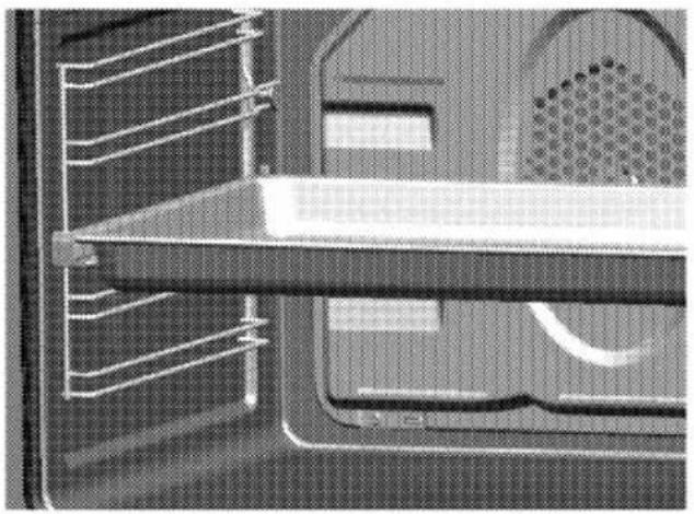 Close-up of a mechanical component with internal channels and mounting holes (no visible text or symbols)