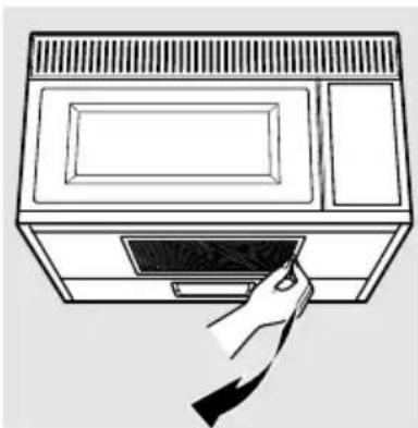 Line drawing of a microwave oven with a hand inserting a cable into the tray (no text or symbols)