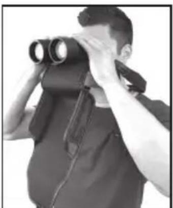 Person using binoculars to observe or inspecting a person's face (no text or symbols visible)