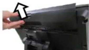 Close-up of a hand pressing down on a black electronic device (no visible text or symbols)