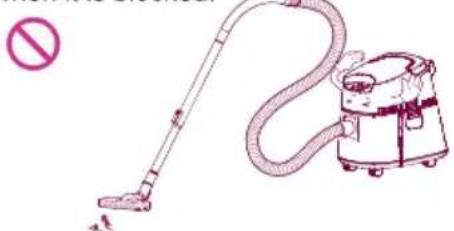 Illustration of a vacuum cleaner with a stop sign (no text or symbols on the cleaner itself)