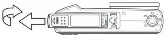 Line drawing of a device with directional arrows indicating rotation or movement (no text or symbols)