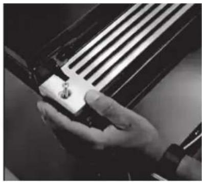 Close-up of a hand pressing down on a guitar fretboard (no text or symbols visible)