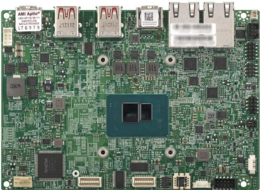 Green printed circuit board with various electronic components and connectors (no readable text or symbols)