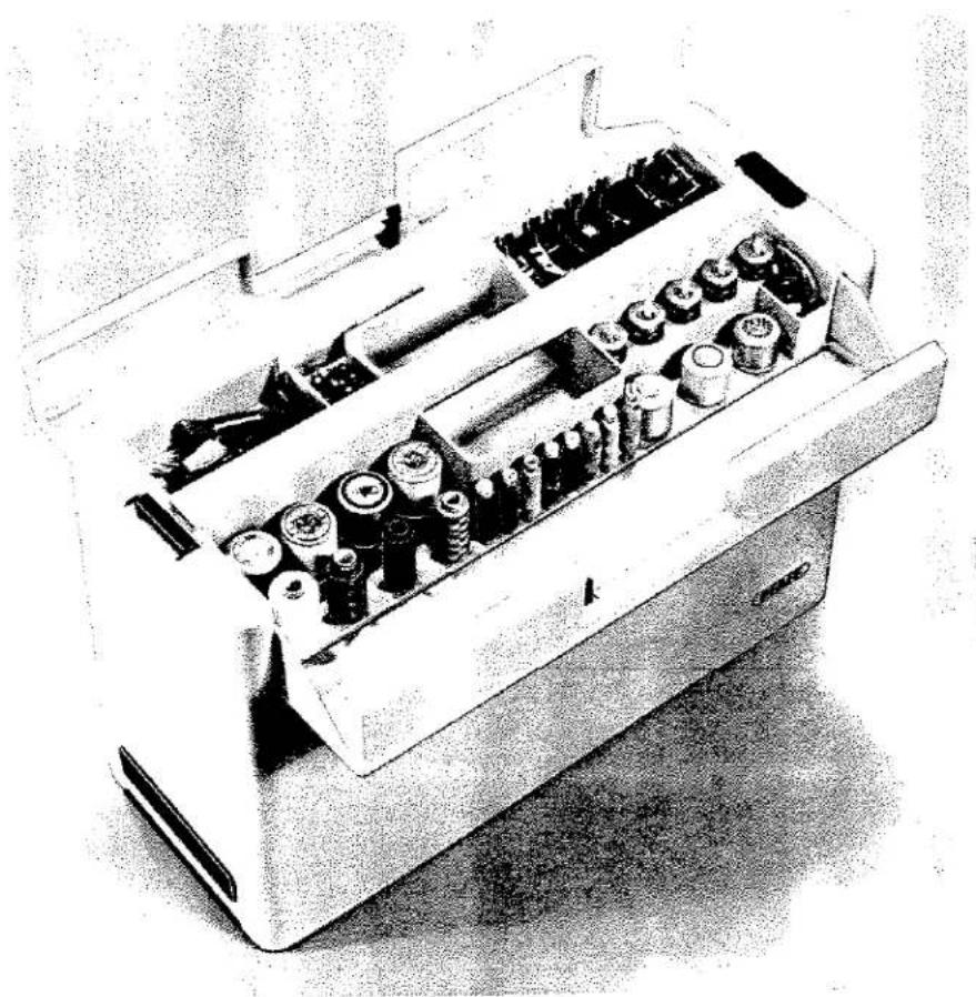 Illustration en noir et blanc d'un porte-outil mécanique avec plusieurs composants cylindriques (aucun texte ou symbole visible)