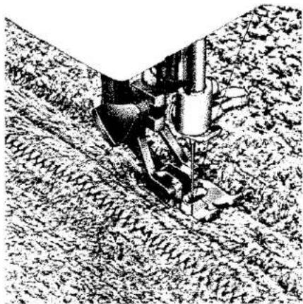 Illustration en noir et blanc d'un dispositif mécanique inséré dans le sol, sans texte ni symbole visible.