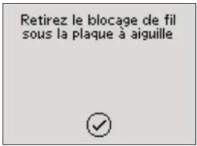 Retirez le blocage de fil sous la plaque à aiguille
