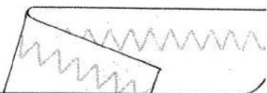 Simple line drawing of a folded paper or sheet with wavy lines, no text or symbols present.