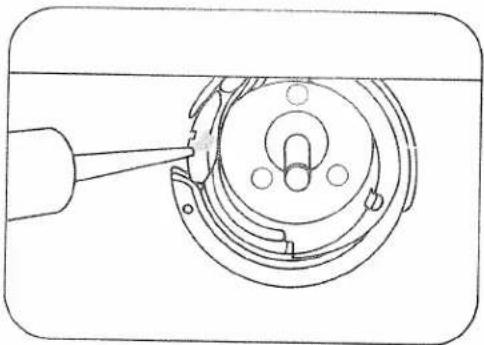 Technical line drawing of a mechanical component with a tool inserted, showing internal components and mounting holes (no text or symbols)