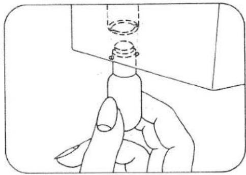 Line drawing of a hand holding a cylindrical object with a dashed circular feature above it (no text or symbols)