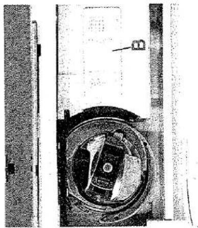 Gros plan d'un composant mécanique avec une ouverture circulaire et une section étiquetée (B), aucun texte ou symbole lisible.