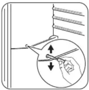 Illustration of a hand using a tool to cut a circular object with arrows indicating direction (no text or symbols)