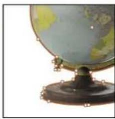 Close-up of a vintage globe on a stand, showing continents and latitude/longitude lines (no text or symbols visible)