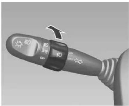 Close-up of a car alternator switch with labeled buttons and directional arrows indicating action or speed.