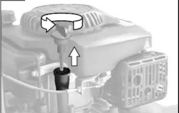 Close-up of a mechanical component with a tool inserted into a cylindrical part, showing directional arrows (no text or symbols)